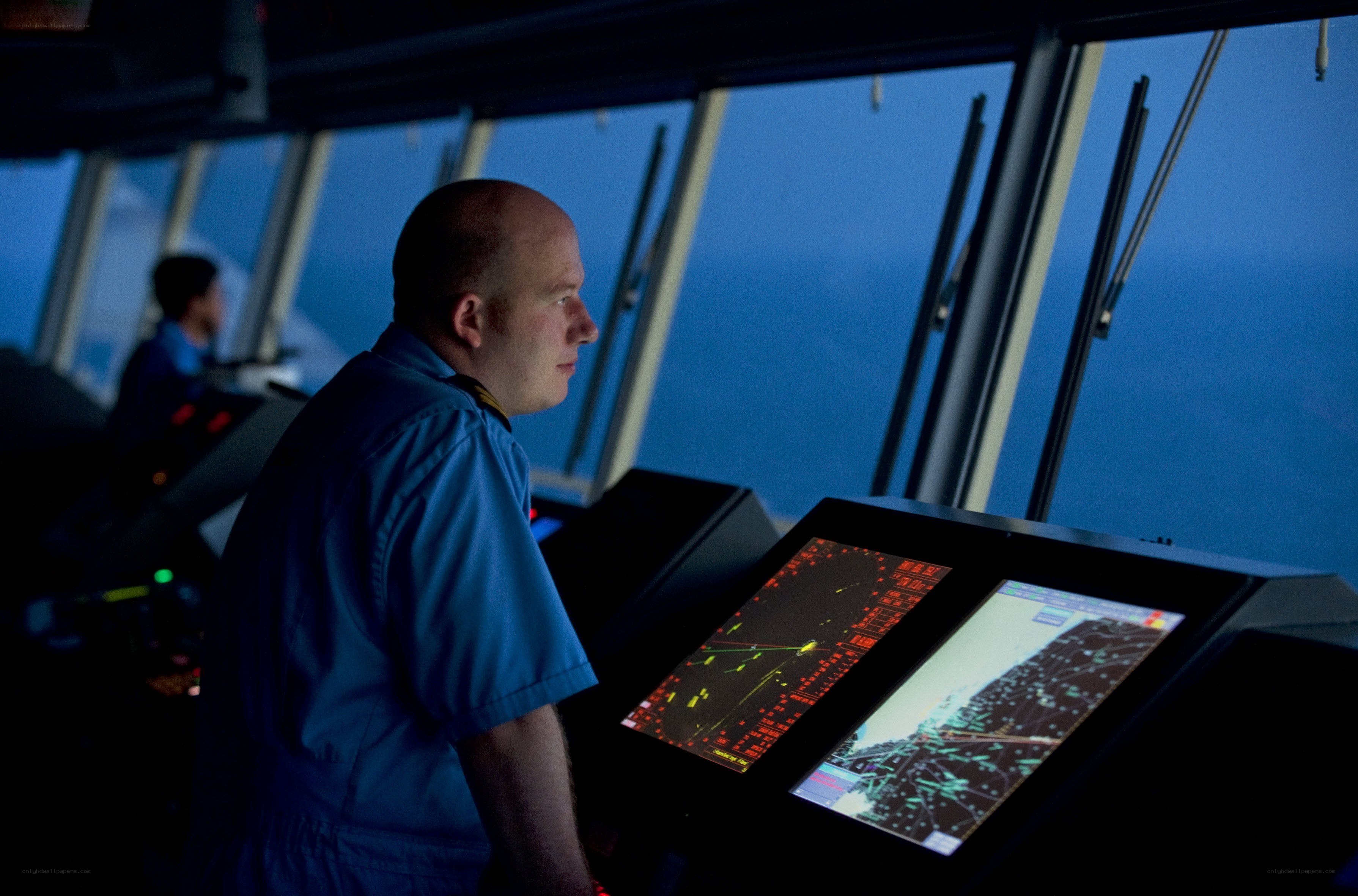 Ship officer on bridge at night