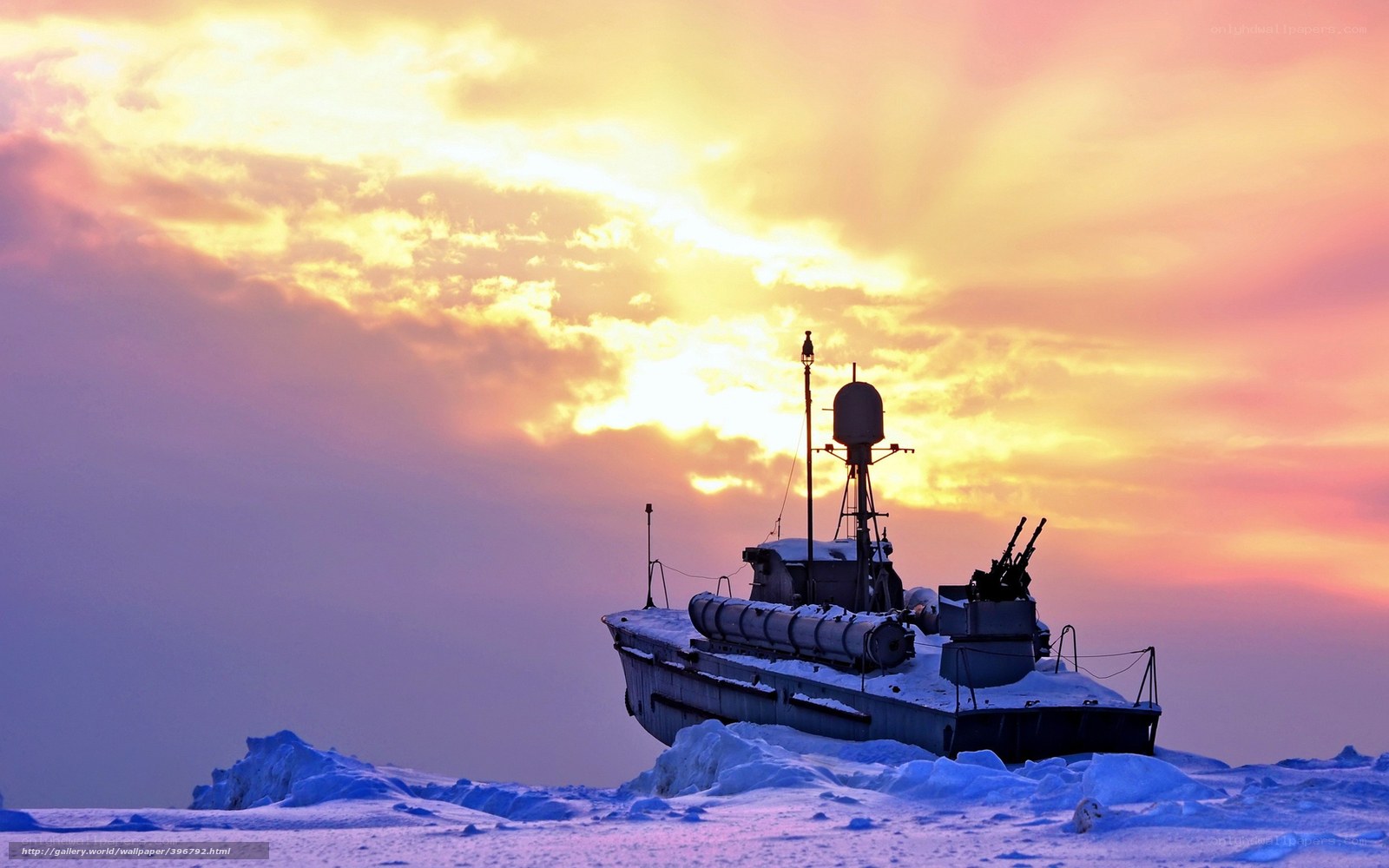 Ship on ice at sunset