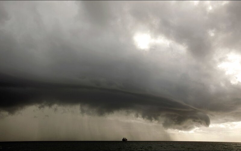 Ship under Storm Clouds