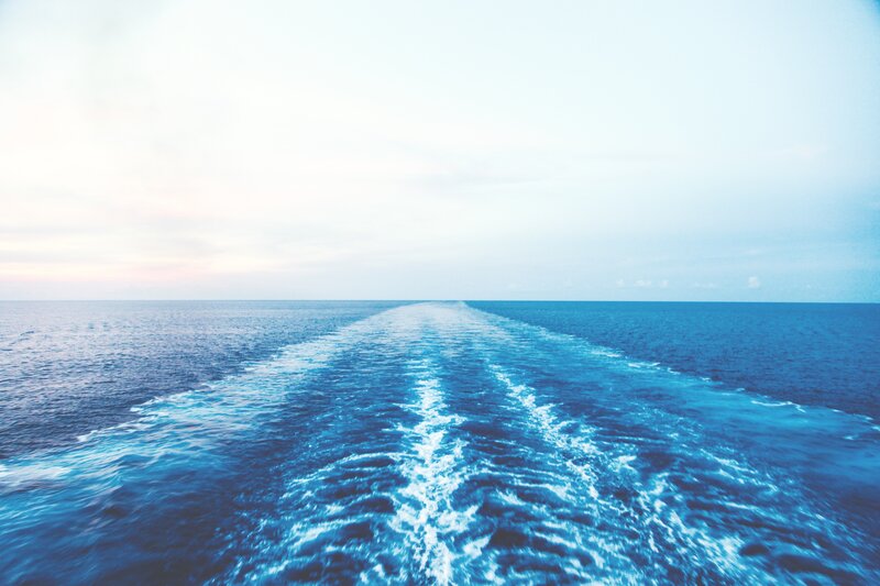 Ship Wake on Ocean — Blue, Serene, Sunset