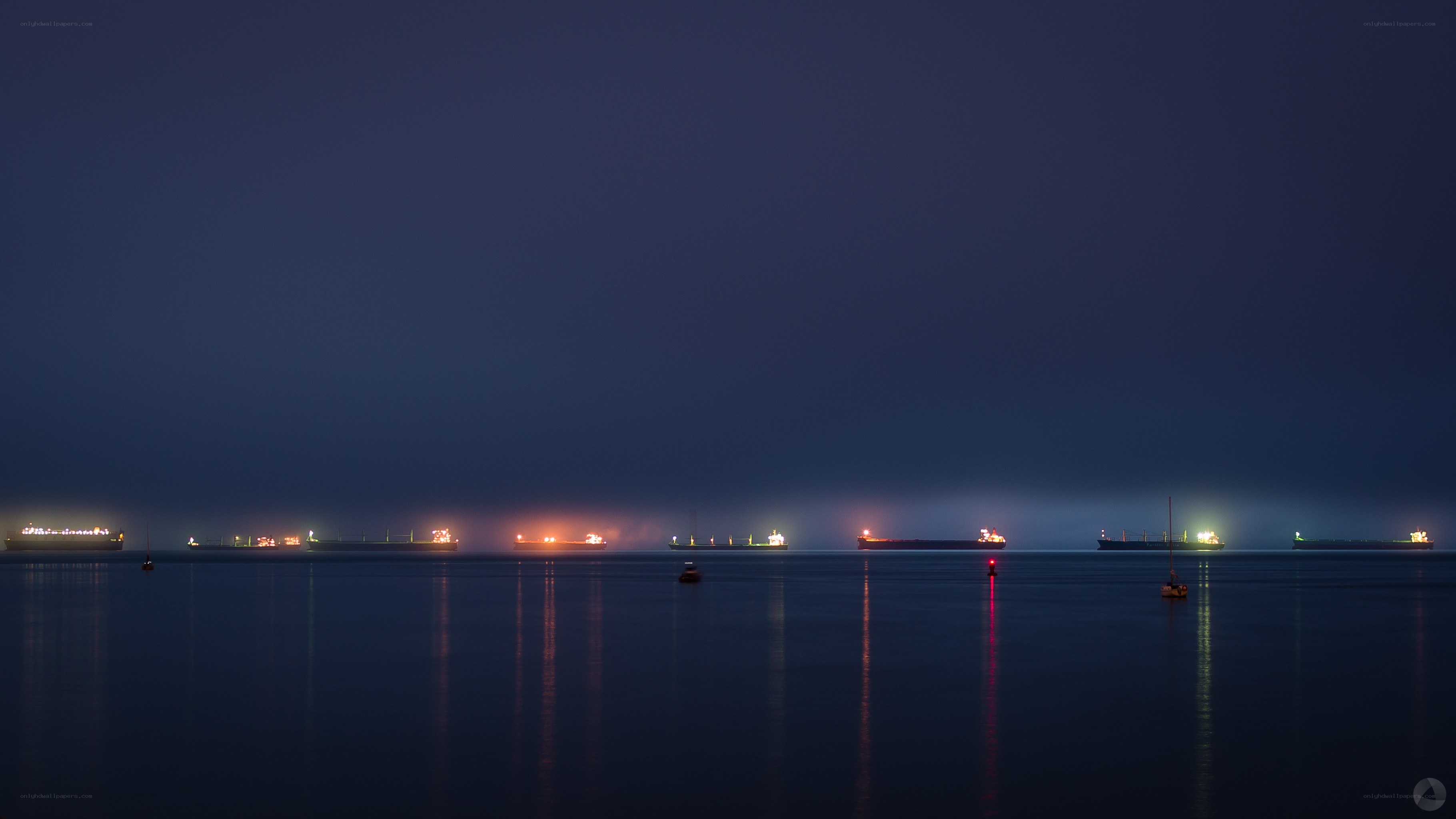 ships at night in harbor