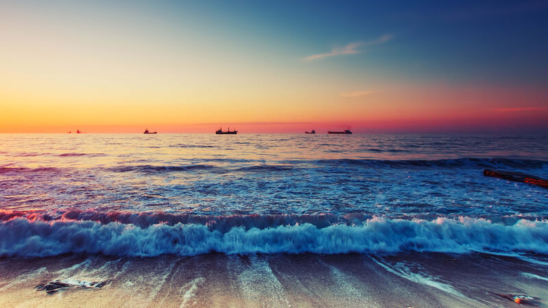 Ships at Sea During Sunset — Blue