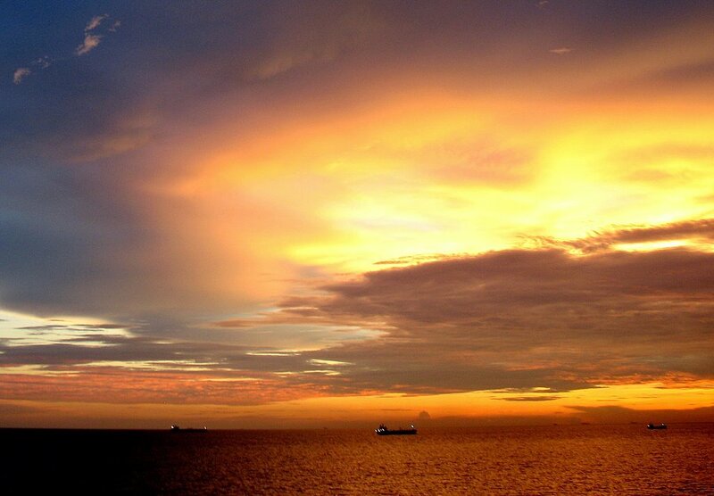 Ships on Ocean at Sunset