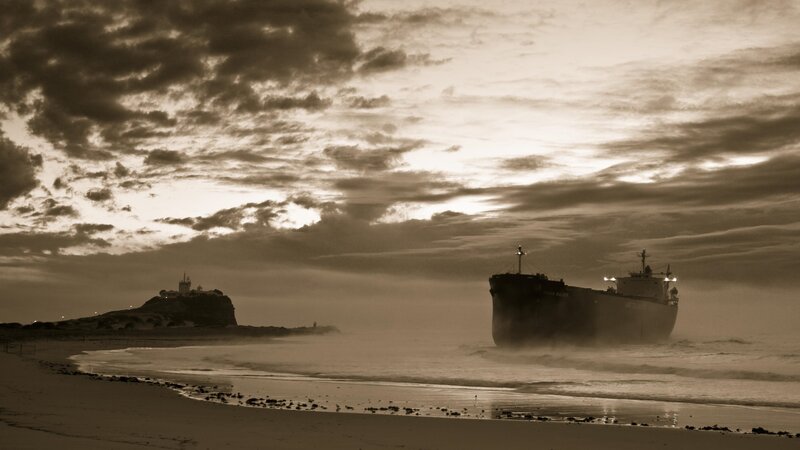 shipwreck at dawn on beach