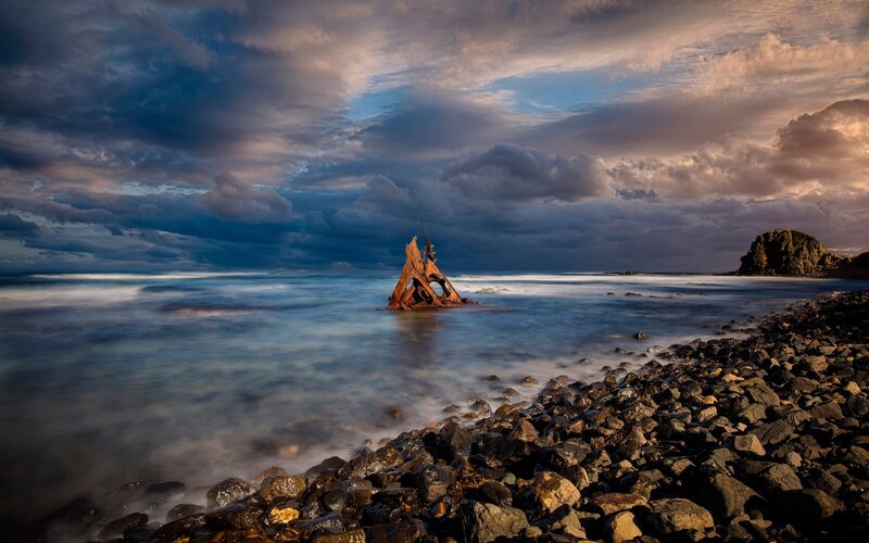 Shipwreck in Ocean — Blue, Dramatic, Sunset, Photograph