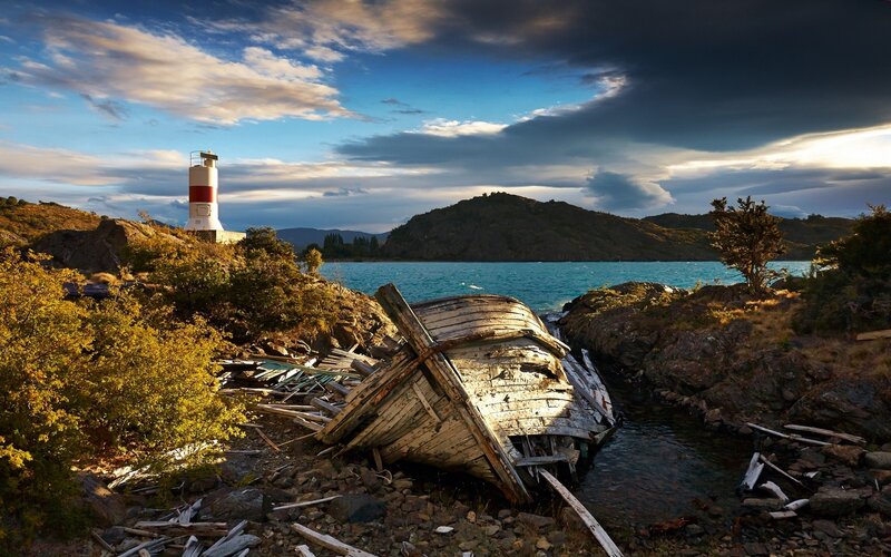 Shipwreck Near Lighthouse — Blue, Dramatic