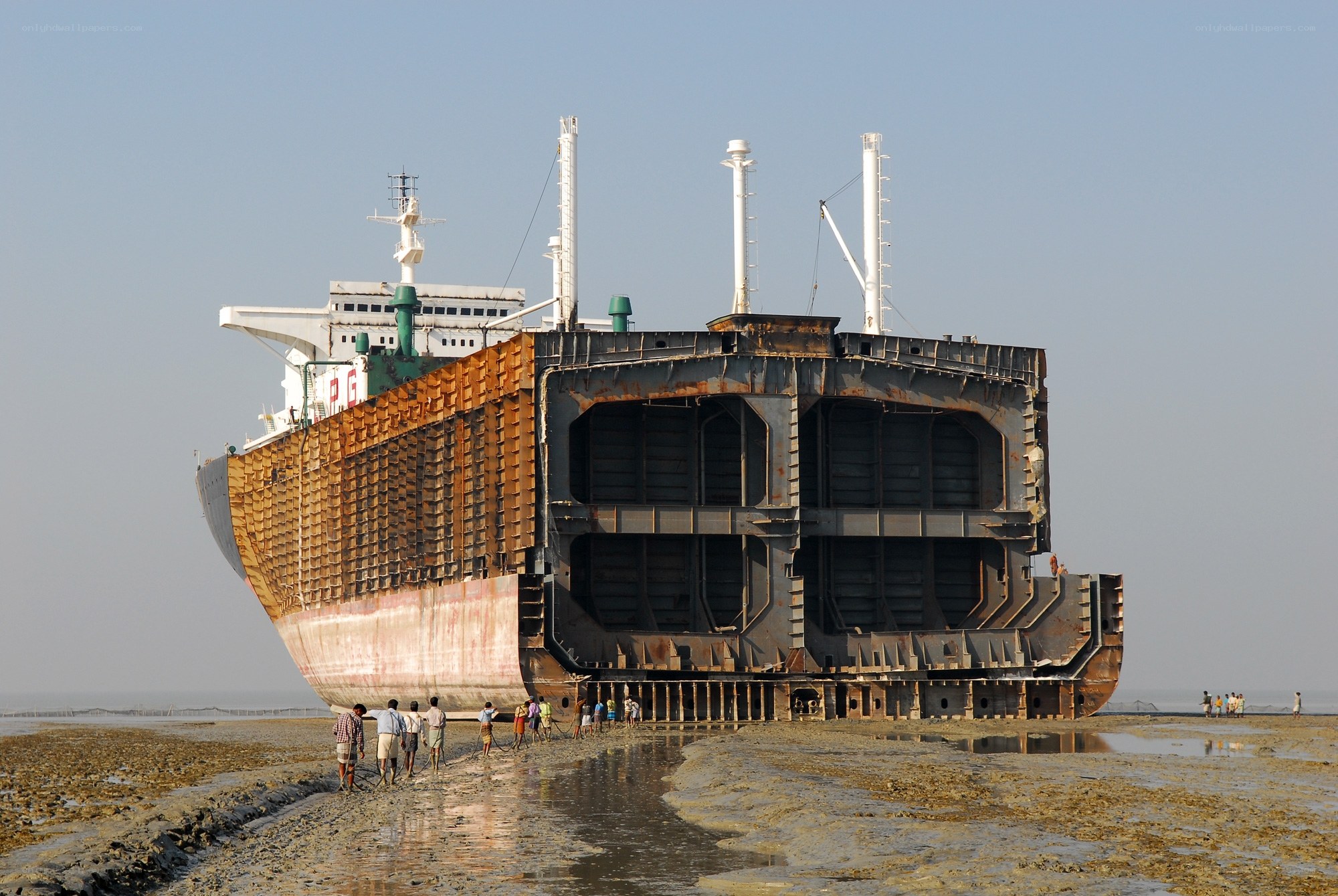 shipwreck on a muddy shore