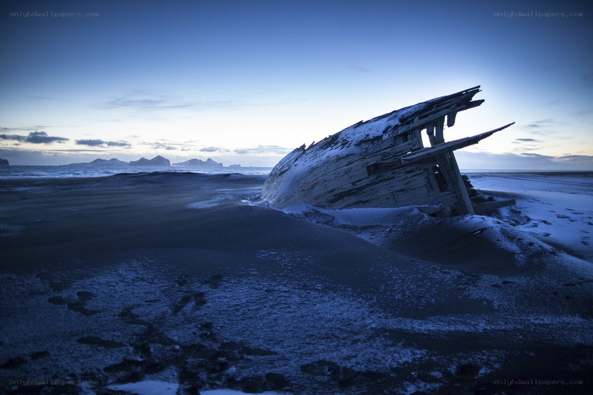 Shipwreck on a snowy beach