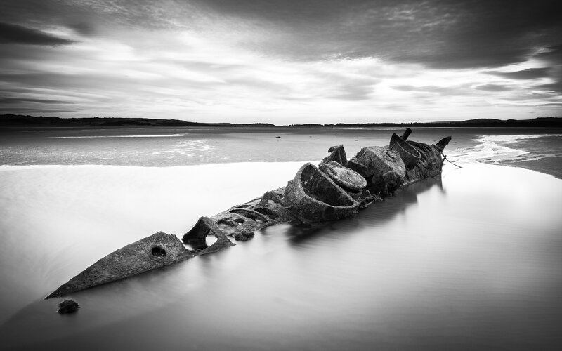 Shipwreck on Beach — Black, Dramatic, Sunset