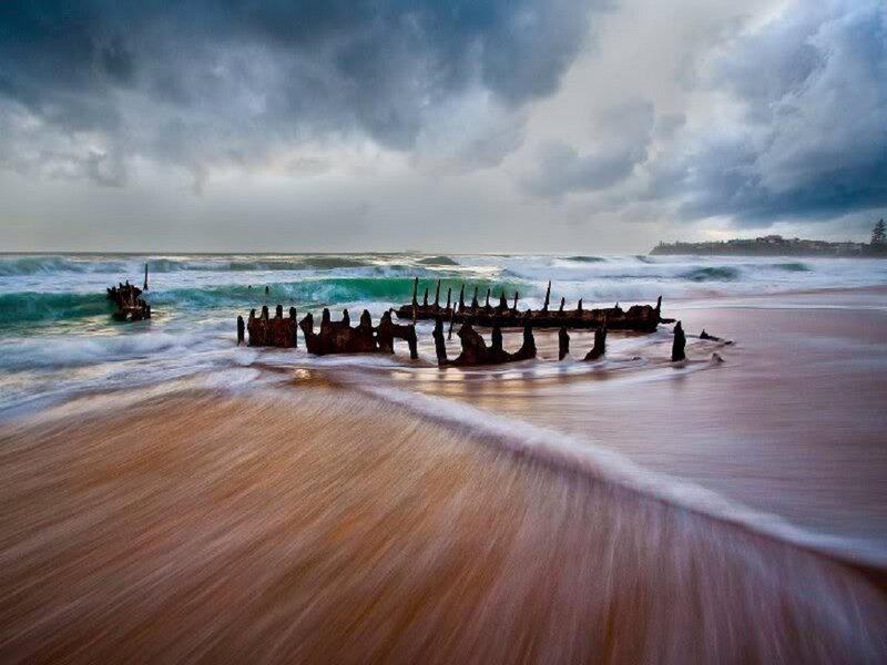 Shipwreck on Beach — Blue, Dramatic, Afternoon