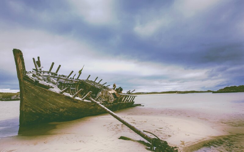 Shipwreck on Beach — Blue, Dramatic, Photograph