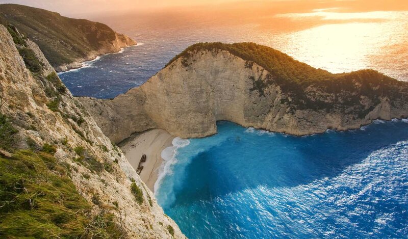 Shipwreck on Beach — Blue, Dramatic, Sunset, Photograph, Cliffs