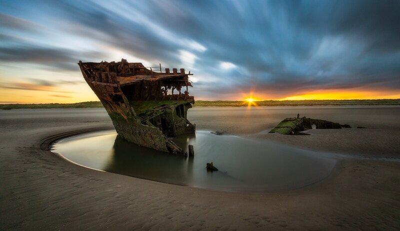 Shipwreck on Beach — Blue, Dramatic, Sunset, Photograph, Sun