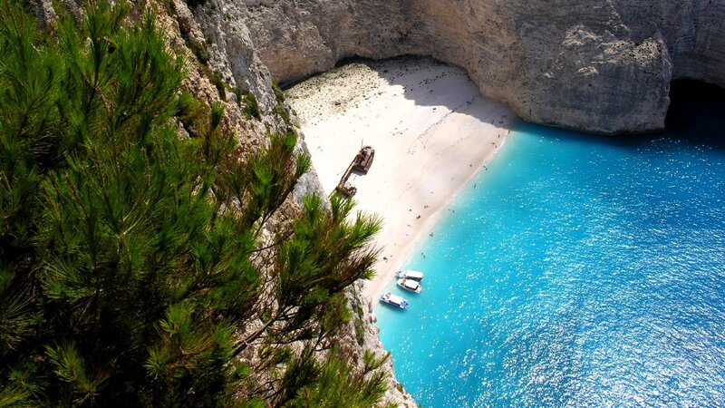 Shipwreck on Beach — Blue, Serene, Afternoon, Photograph, Boat, Cliff, White