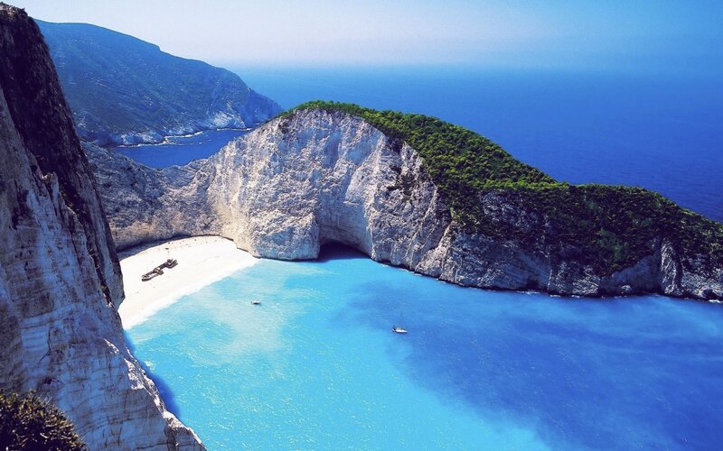 Shipwreck on Beach — Blue, Serene, Afternoon, Photograph, Cliffs, Boat, Sea
