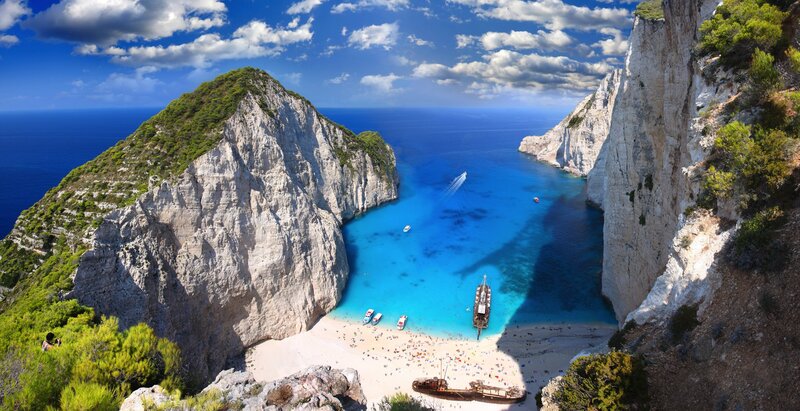 Shipwreck on Beach — Blue, Serene, Afternoon, Photograph, Cliffs, Boats, Sea