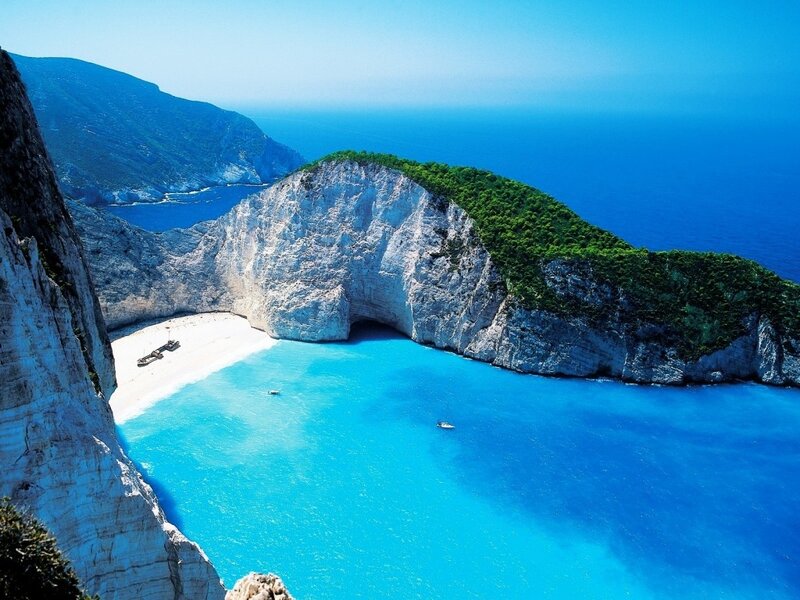 Shipwreck on Beach — Blue, Serene, Afternoon, Photograph, Cliffs, Sea, Boat