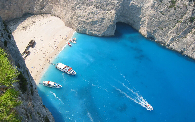 Shipwreck on Beach — Blue, Serene, Afternoon, Photograph