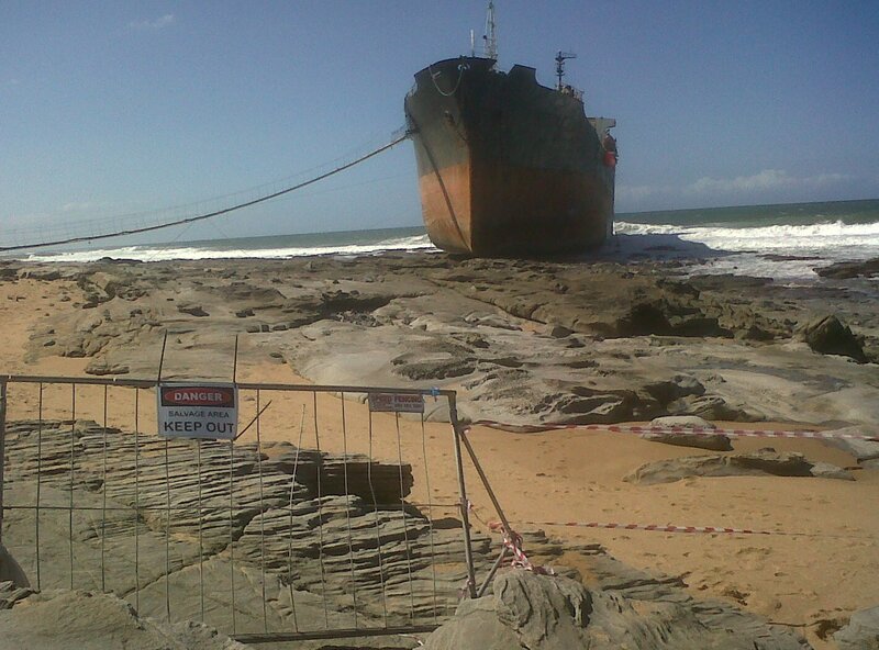 Shipwreck on Beach — Brown, Dramatic, Afternoon