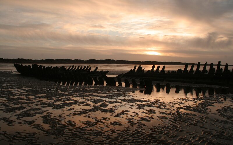 Shipwreck on Beach — Orange, Dramatic, Sunset, Photograph, Wooden Structure