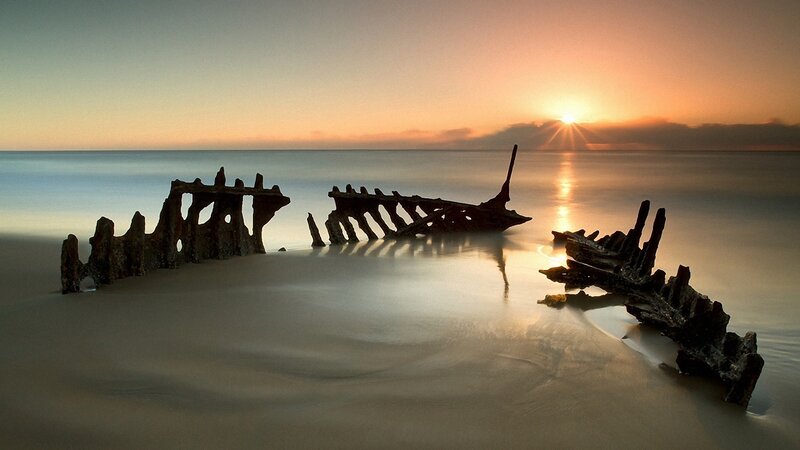 Shipwreck on Beach — Orange, Serene, Sunset, Photograph, Sun