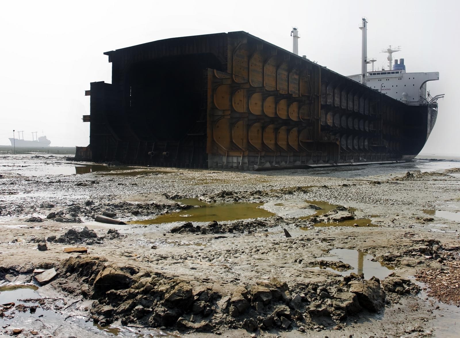 shipwreck on muddy shore