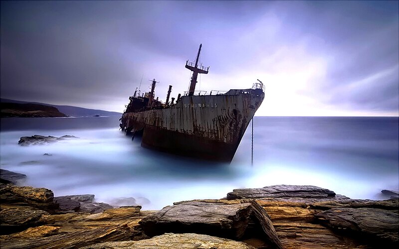 Shipwreck on Rocky Shore — Blue, Dramatic