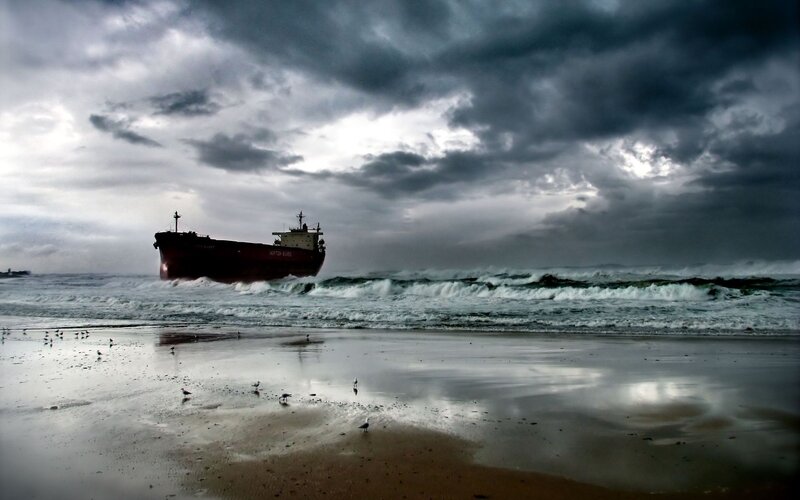 Shipwreck on stormy beach