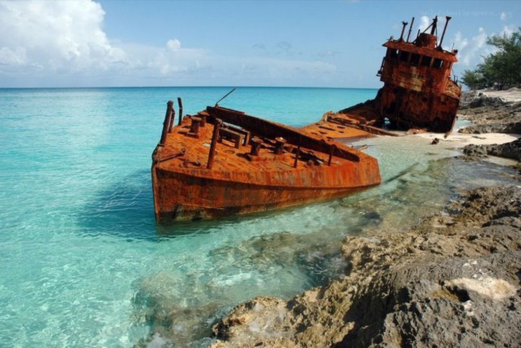 shipwreck on tropical shore