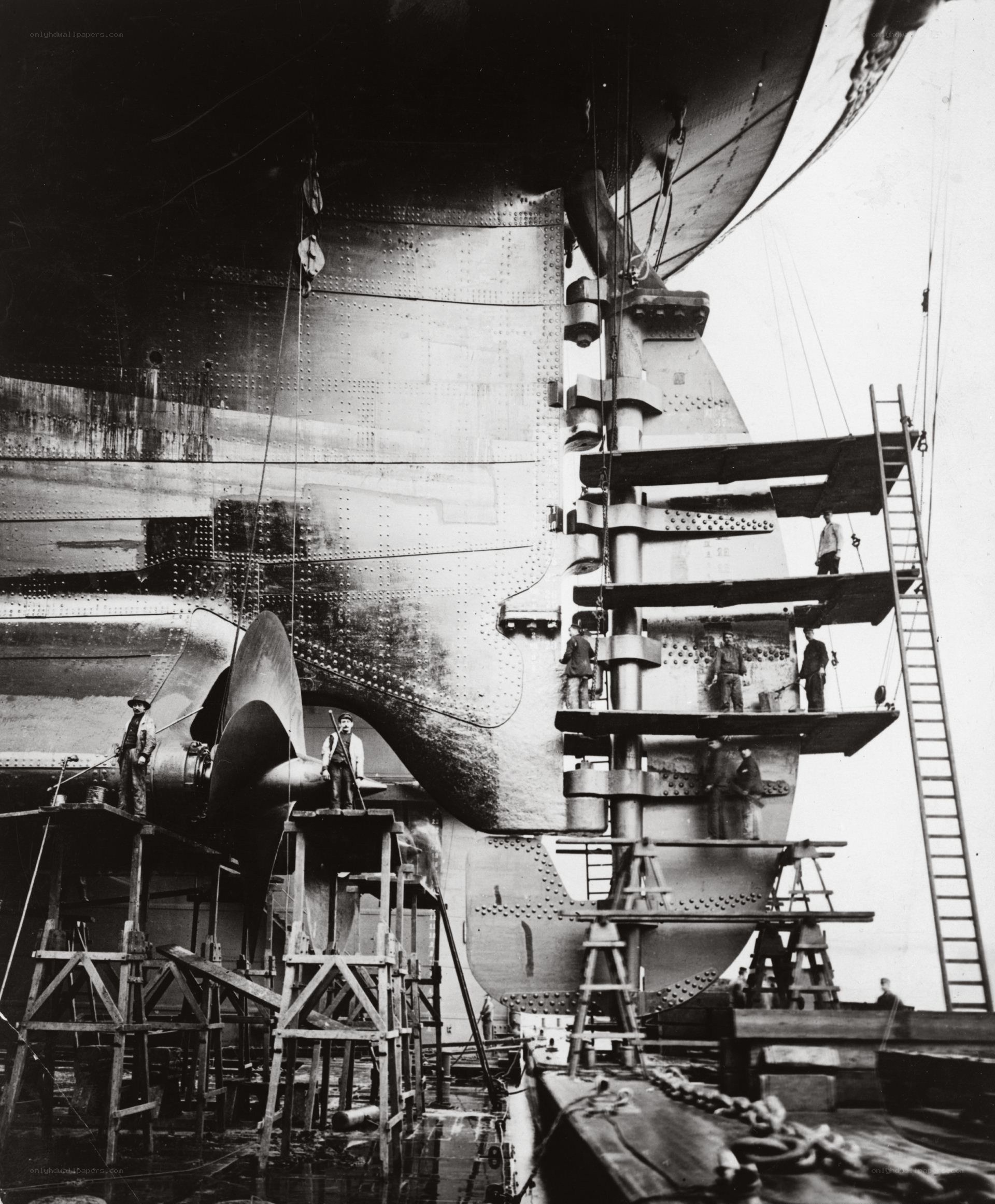 Shipyard workers at stern