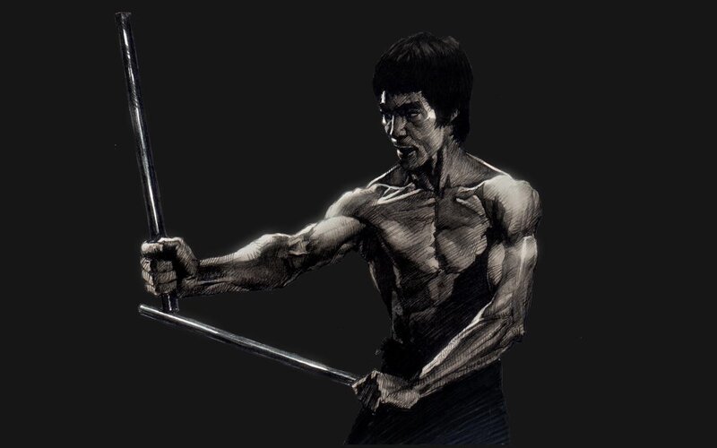 Shirtless Man Holding Staffs