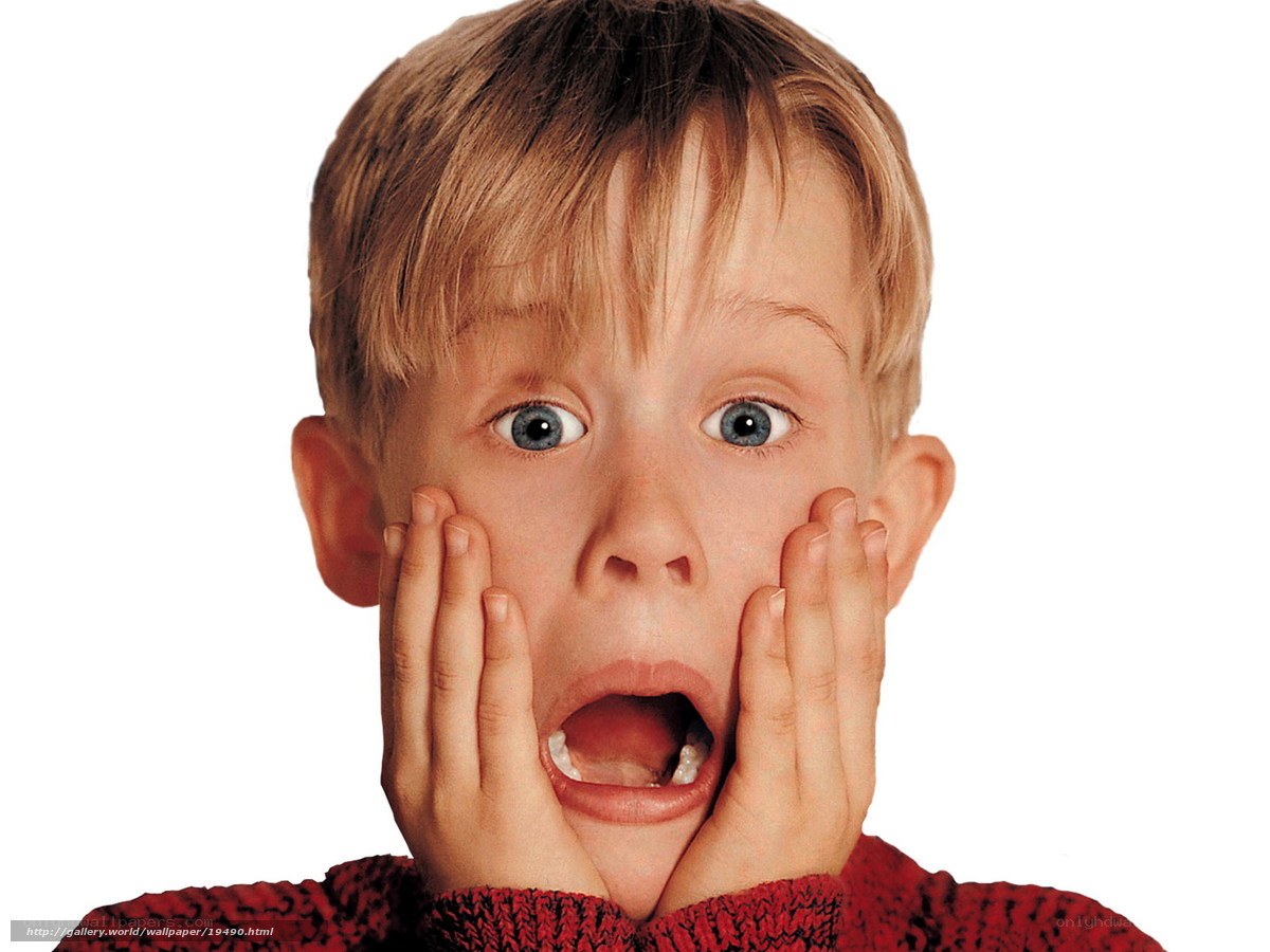shocked boy with hands on face