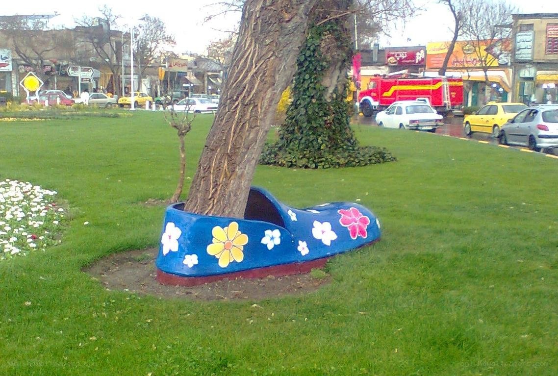 Shoe-shaped planter in a park