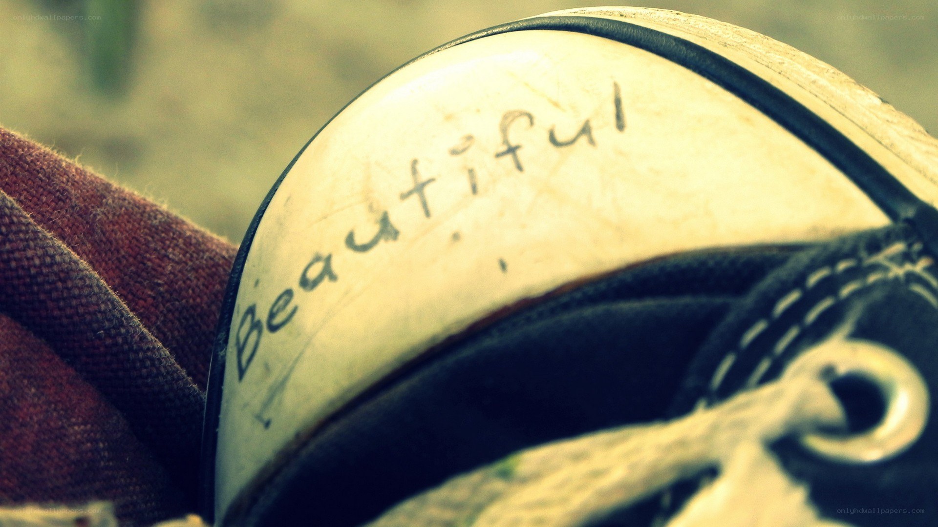 Shoe with 'Beautiful' written on it