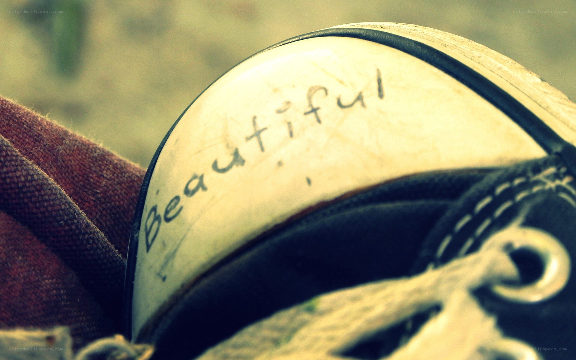 Shoe with 'Beautiful' written on it