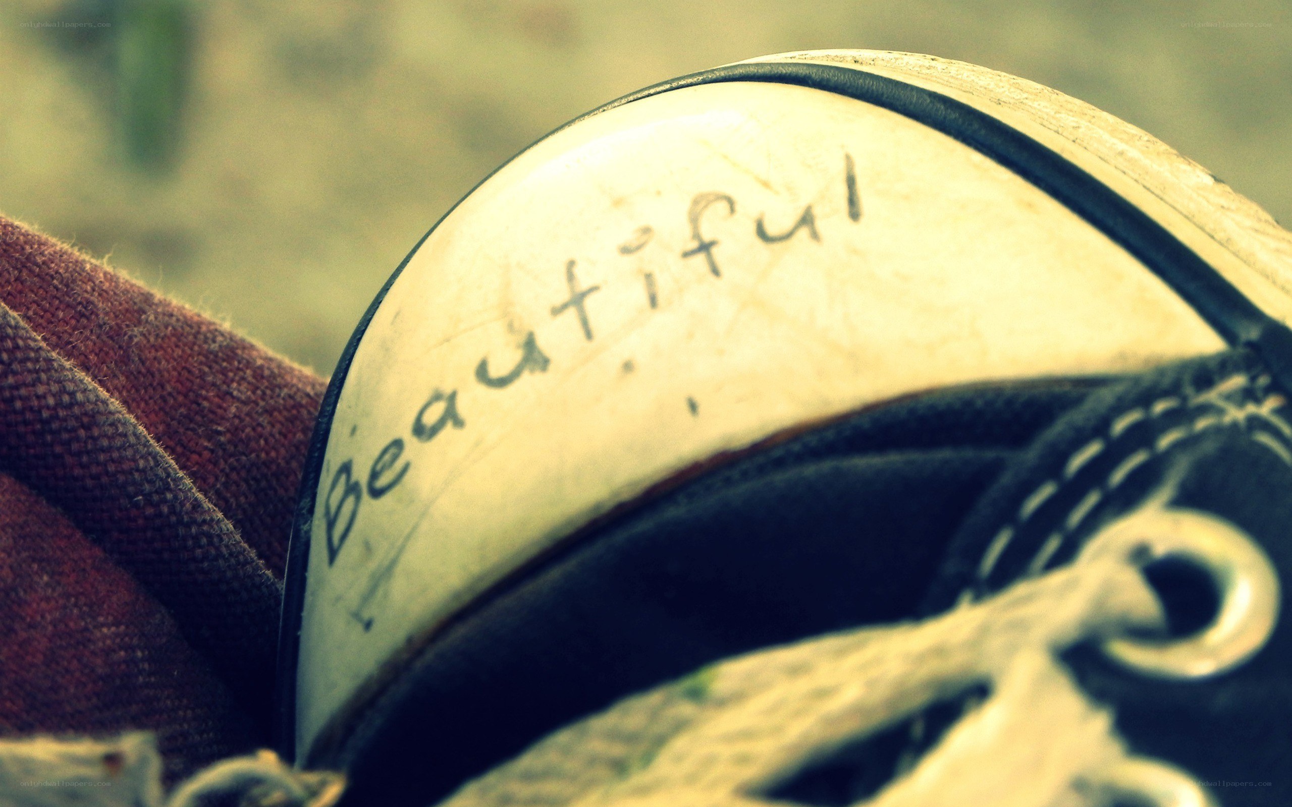 Shoe with 'Beautiful' written on it