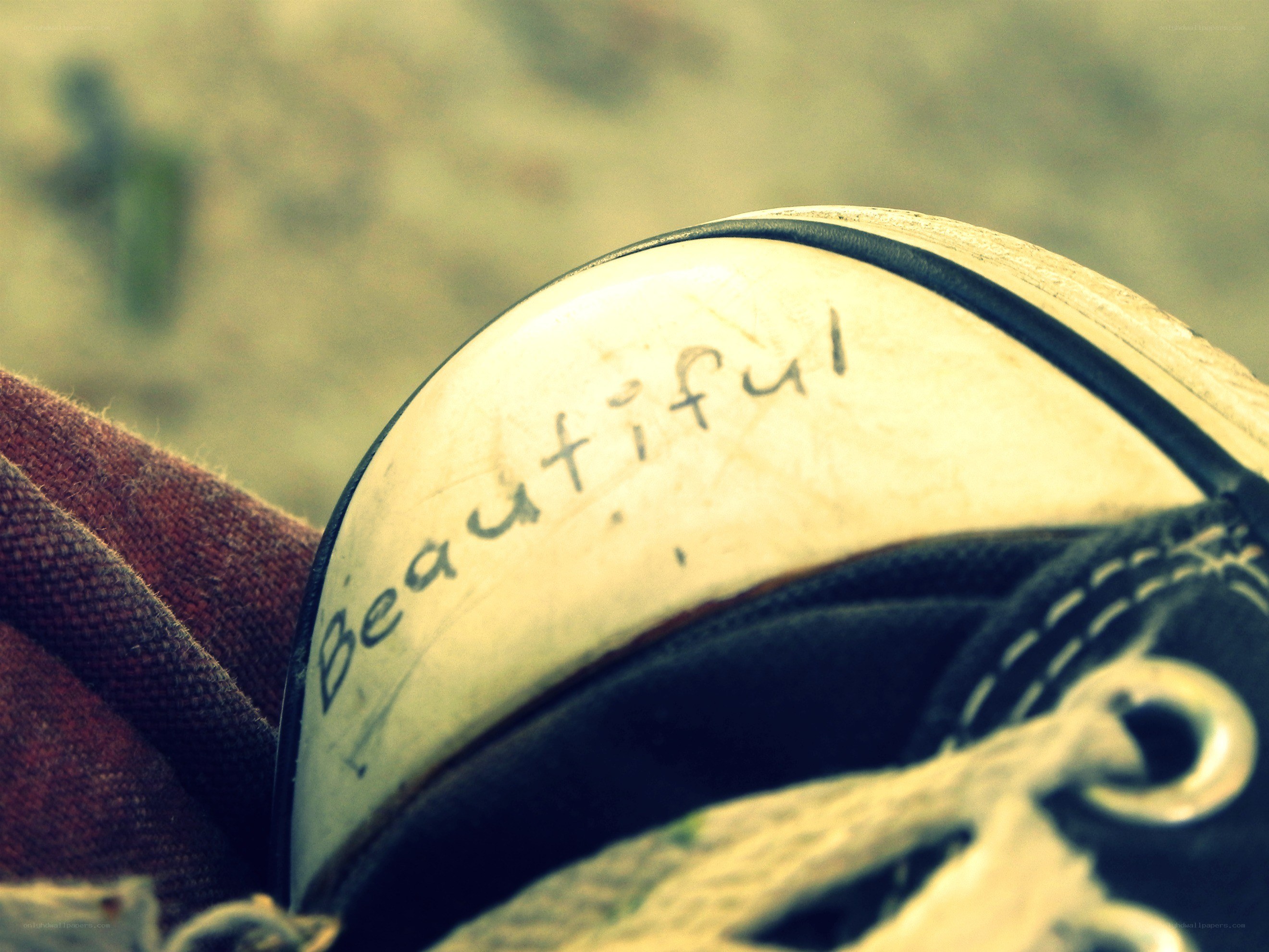 Shoe with 'Beautiful' written on it