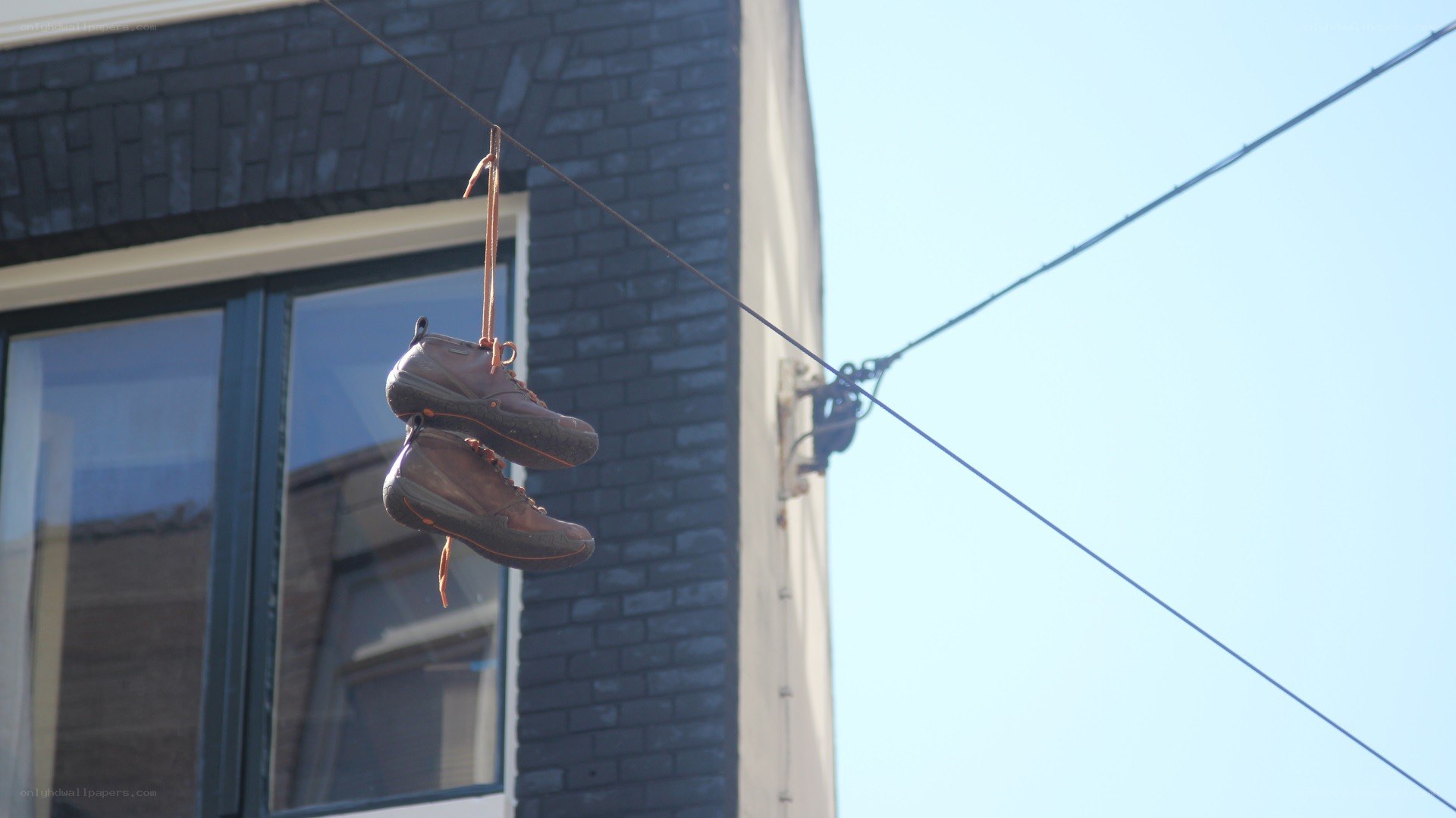 Shoes hanging on a wire