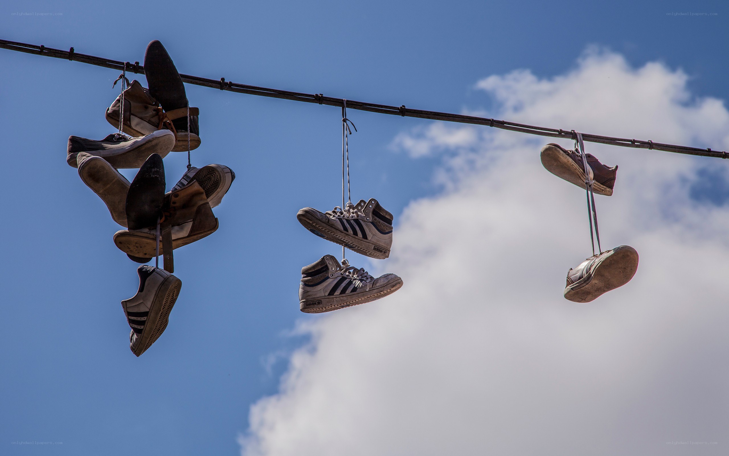 Shoes hanging on a wire