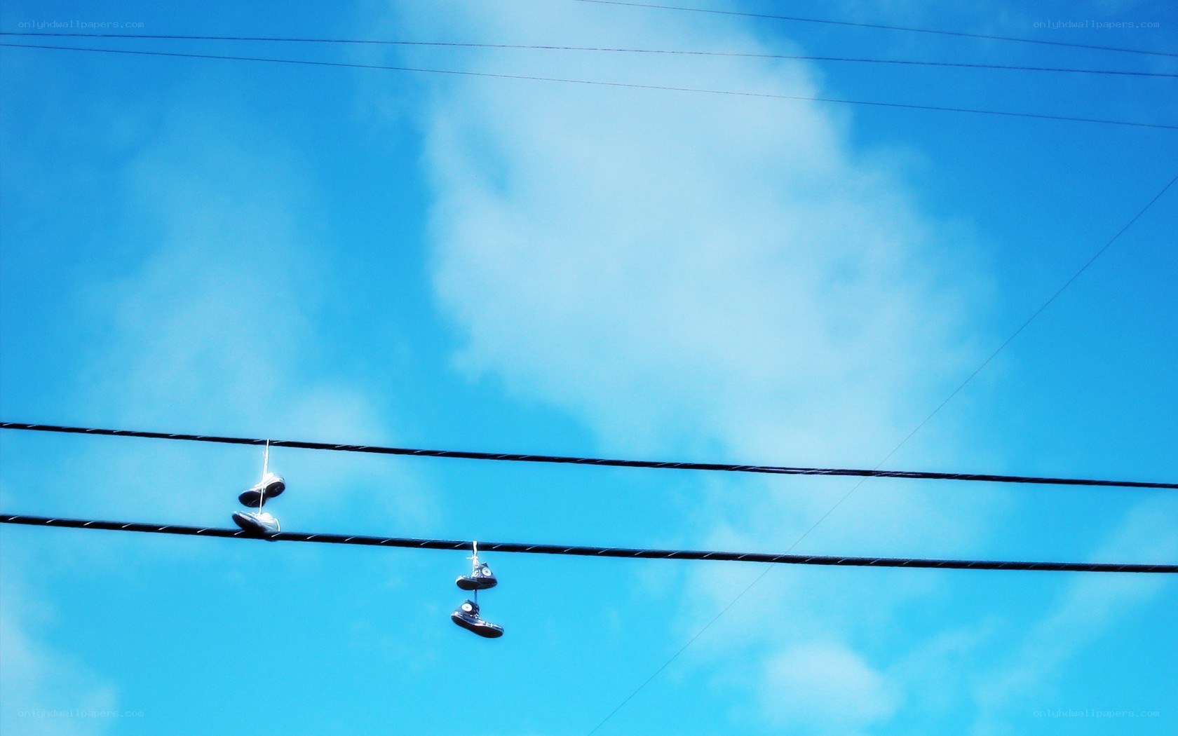 Shoes hanging on power lines