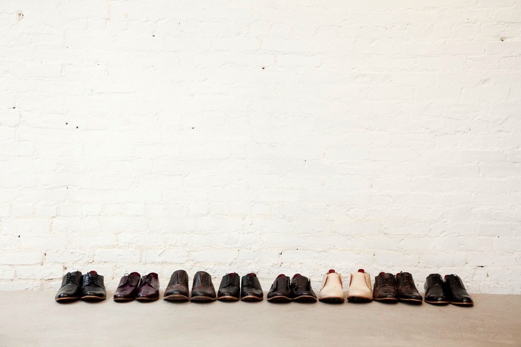 Shoes lined up against a wall