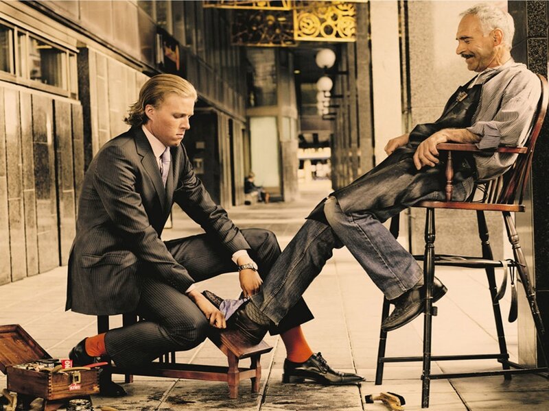 Shoeshiner polishing a man's shoes