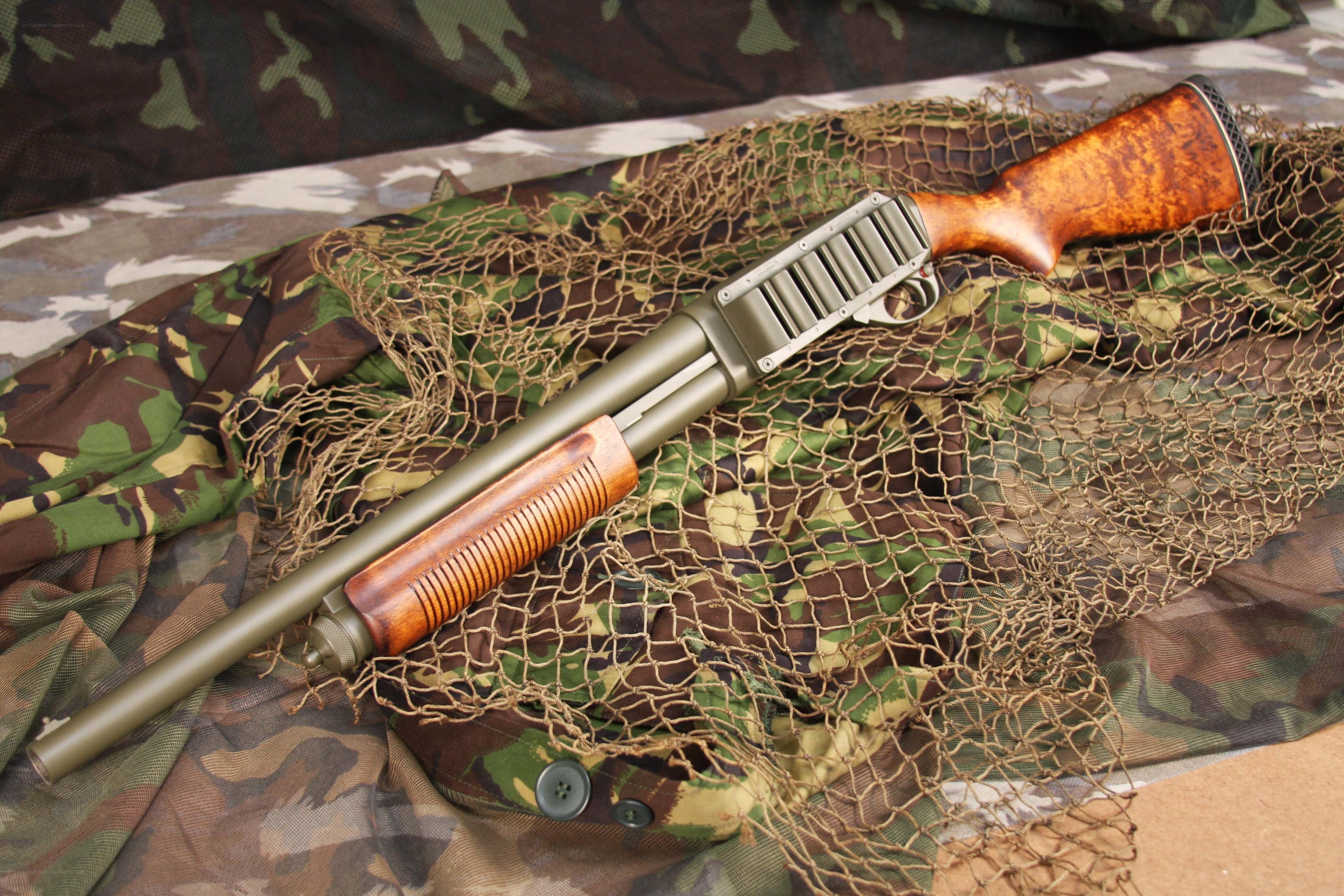 shotgun on camouflage net
