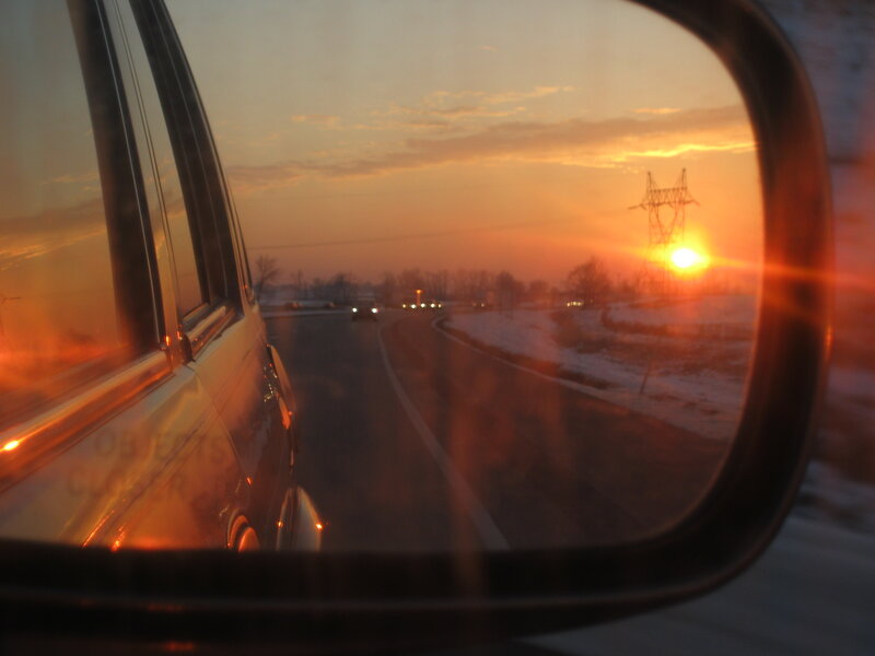 Side Mirror View of Car