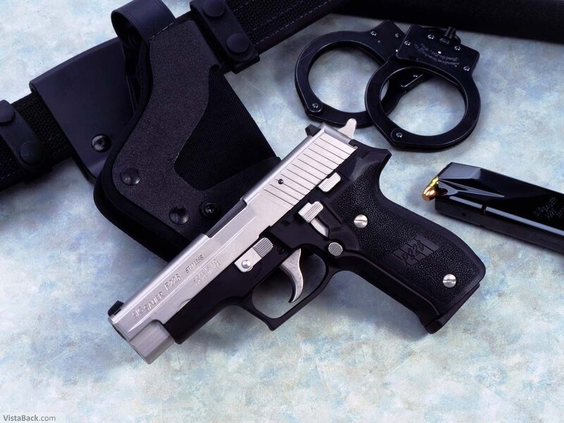 Sig Sauer P226 pistol with accessories