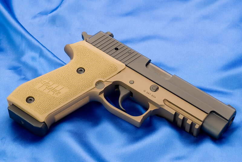 Sig Sauer pistol on blue cloth