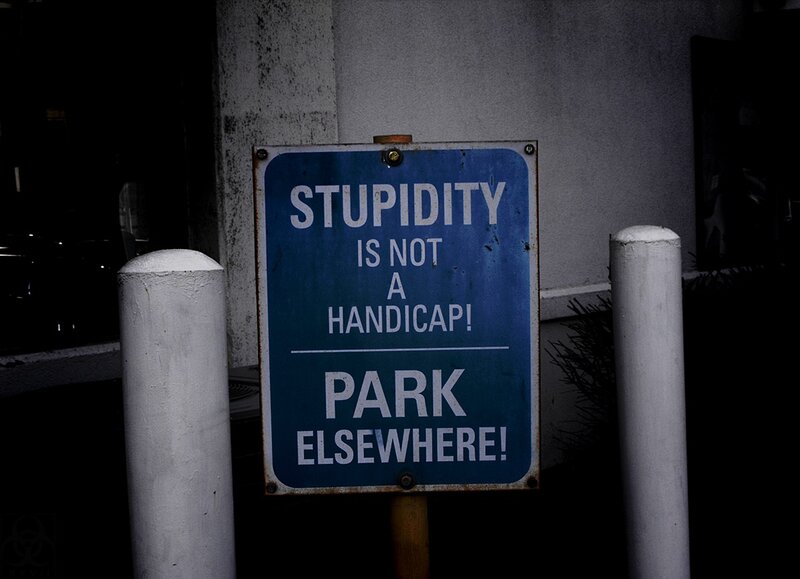 Sign says 'Stupidity is not a handicap'