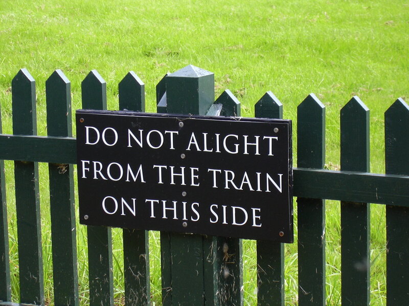 Sign warning not to alight from train