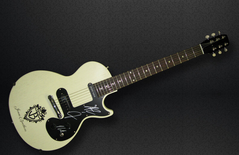 signed white electric guitar