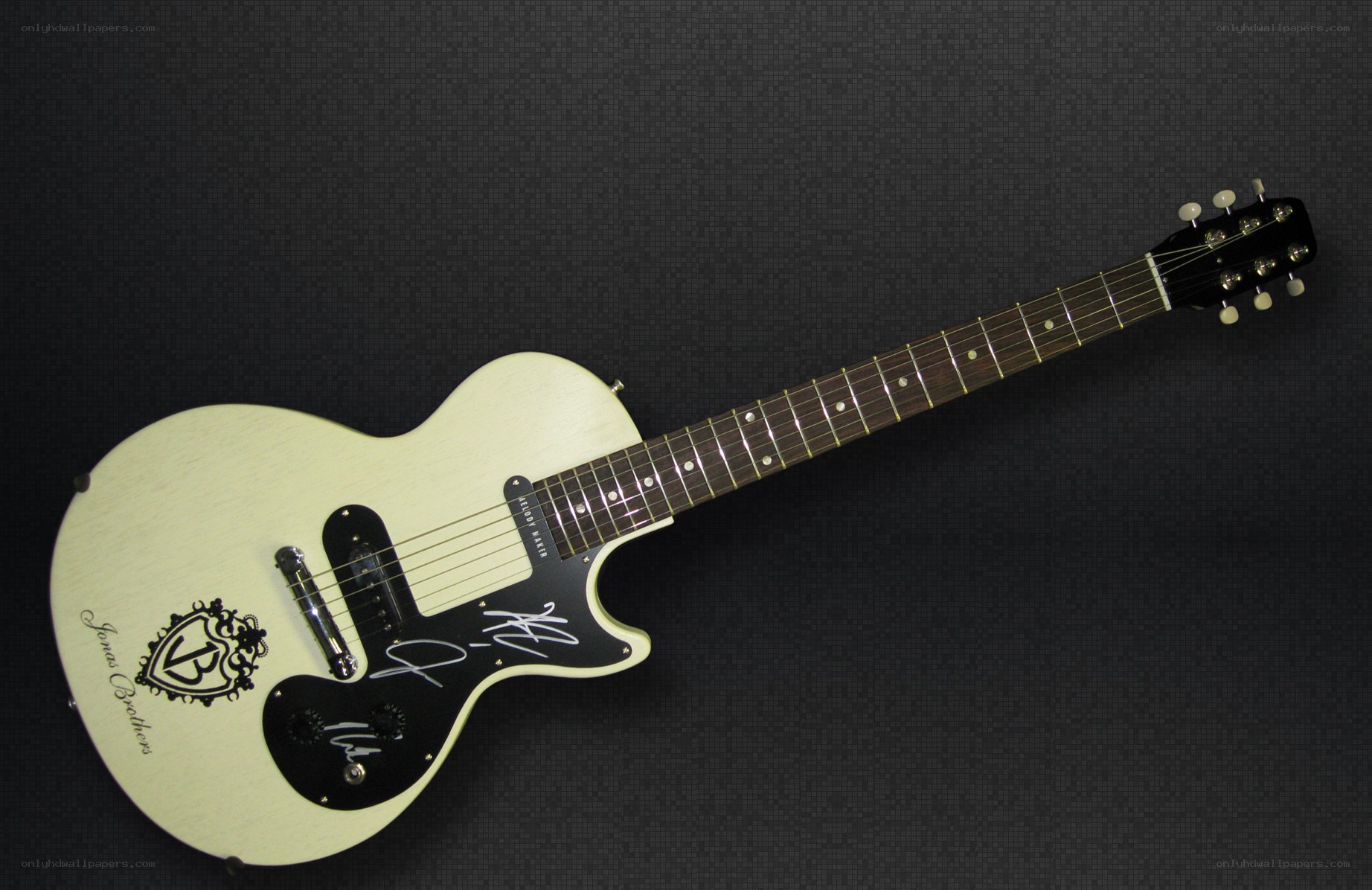 signed white electric guitar